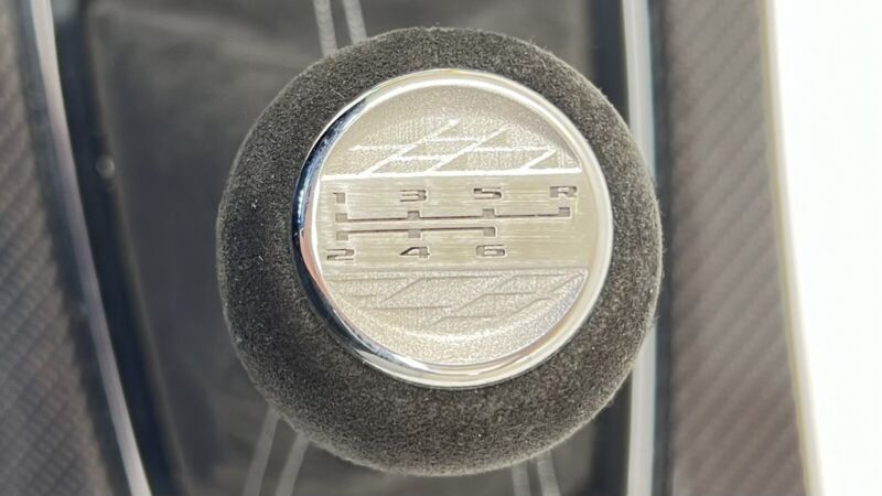 87828564 22-24 CADILLAC CT5 V BLACKWING MANUAL SHIFT BOOT SURROUND PANEL CARBON FIBER OEM