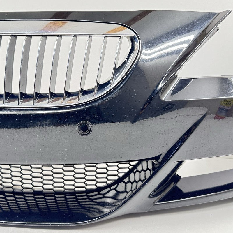 5111 7 899 508 / 51117899508 06-10 BMW M6 E63 E64 FRONT BUMPER COVER COMPLETE WITH GRILLS AND SENSORS OEM
