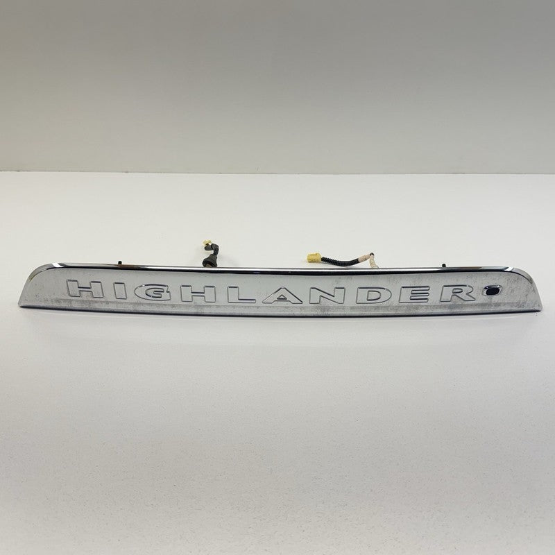 76801-48330/ 76801 48330 / 7680148330 08-13 Toyota Highlander Rear Trunk License Plate Light Trim Moulding Chrome OEM