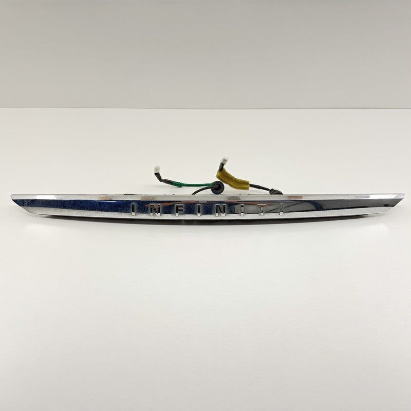 84810-4HB0A / 84810 4HB0A / 848104HB0A 14-17 Infiniti Q50 Chrome License Plate Light Trunk Trim Moulding W/ Camera OEM