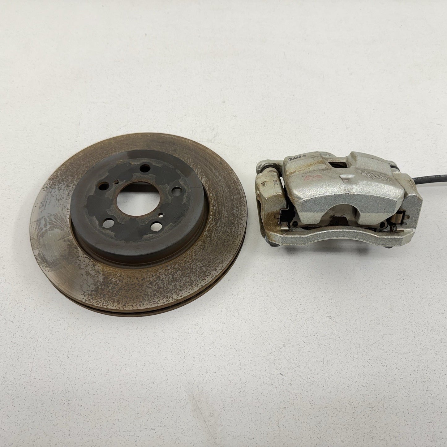 17-22 Toyota Prius Prime Driver Left Front Brake Caliper With Rotor OEM