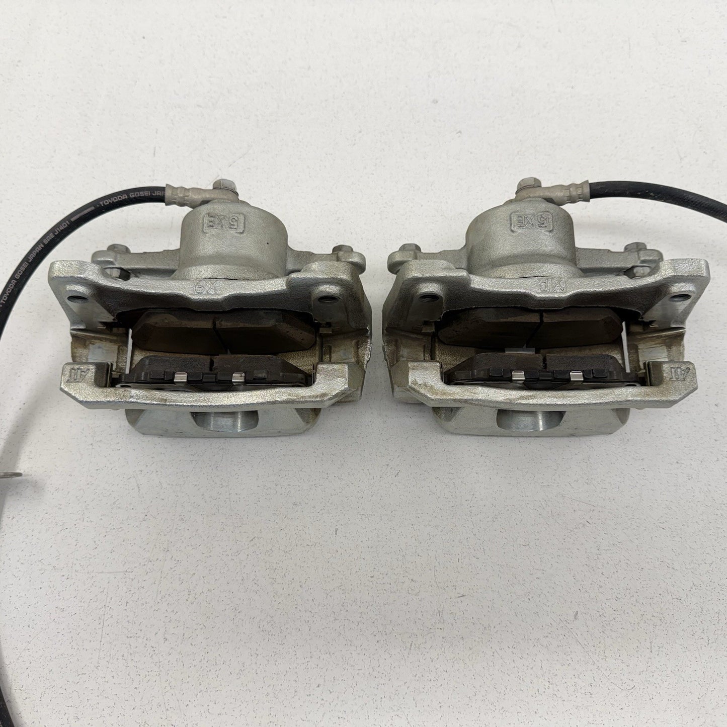 23-26 Toyota Prius FWD Front Advics Brake Caliper Pair Left & Right OEM