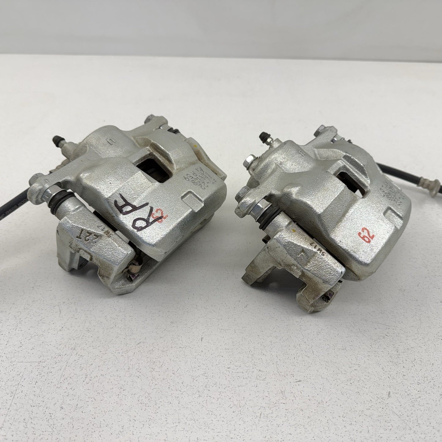 23-26 Toyota Prius FWD Front Advics Brake Caliper Pair Left & Right OEM
