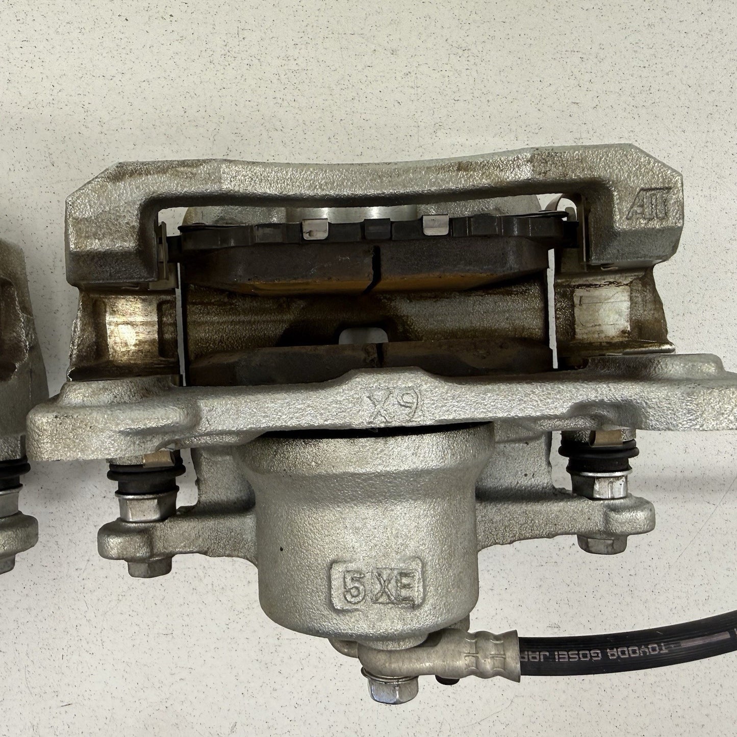 23-26 Toyota Prius FWD Front Advics Brake Caliper Pair Left & Right OEM